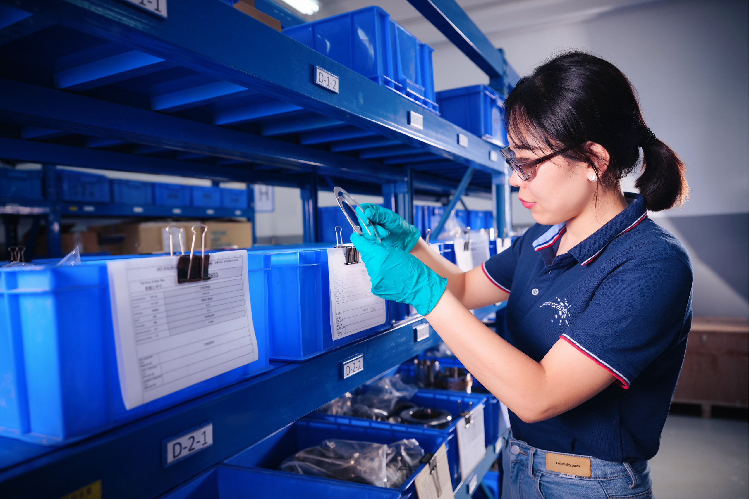 John Crane Employee Examing Product