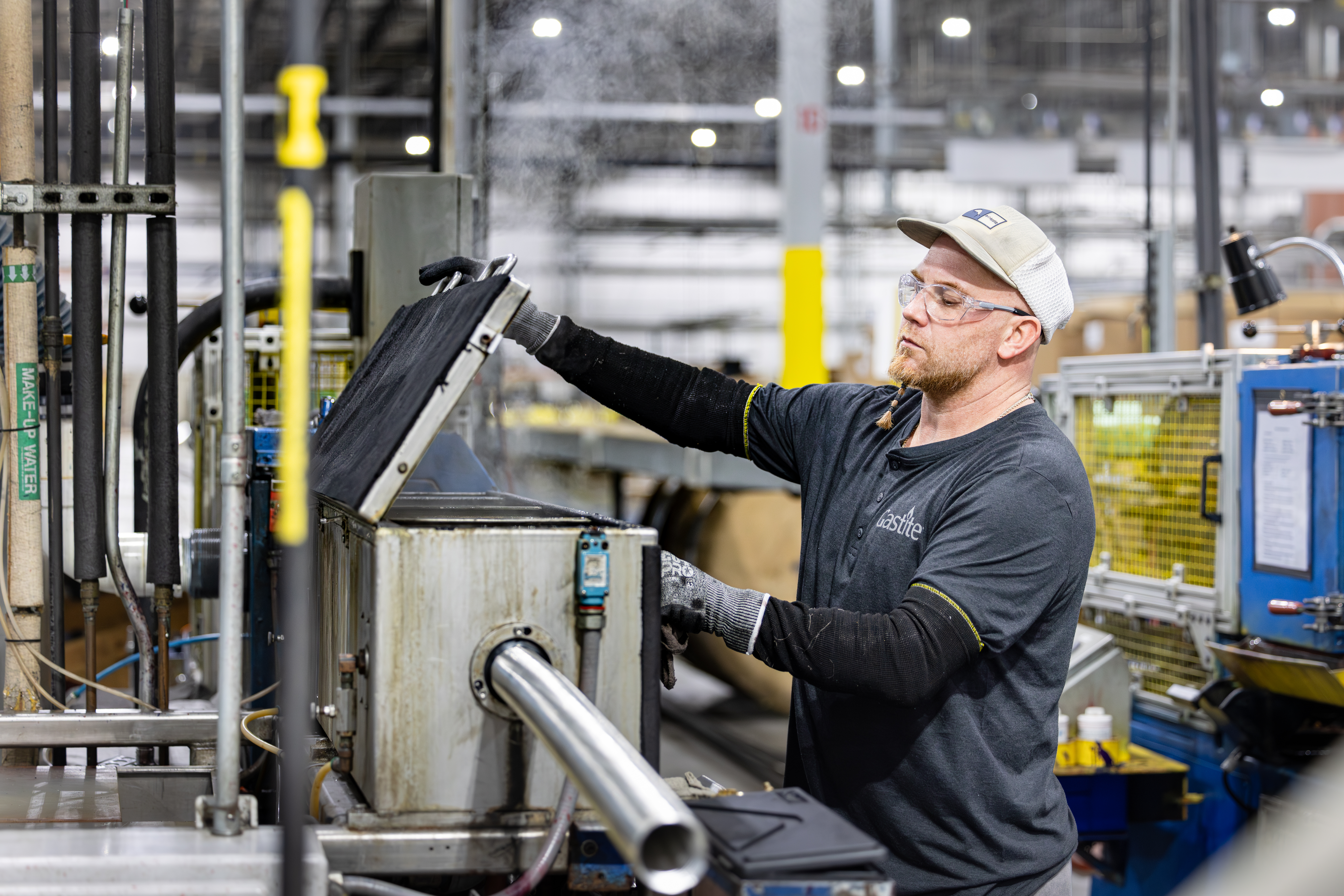Man Wearing Gastite Uniform Working