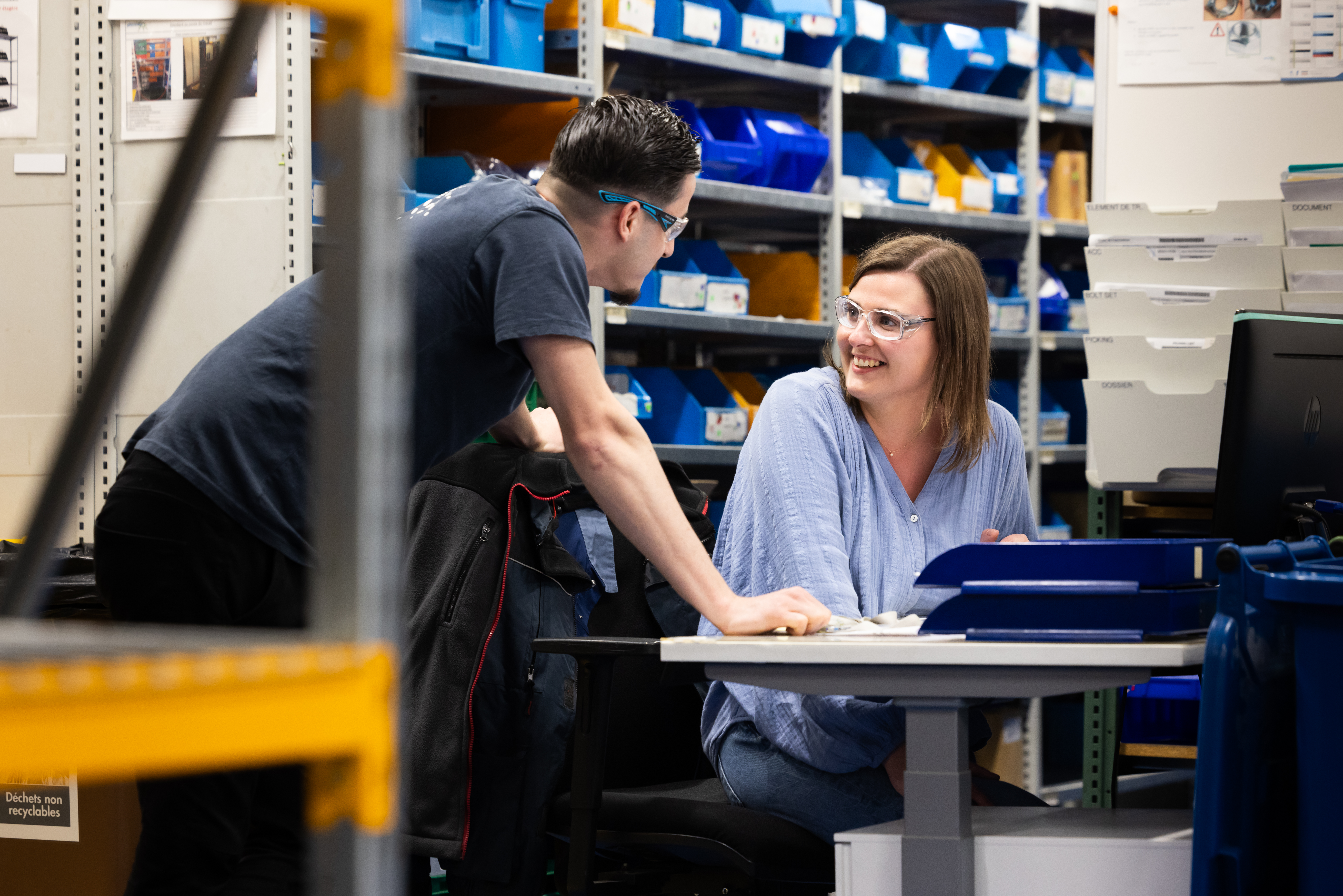 Two Colleagues Talking Wearing Safety Glasses