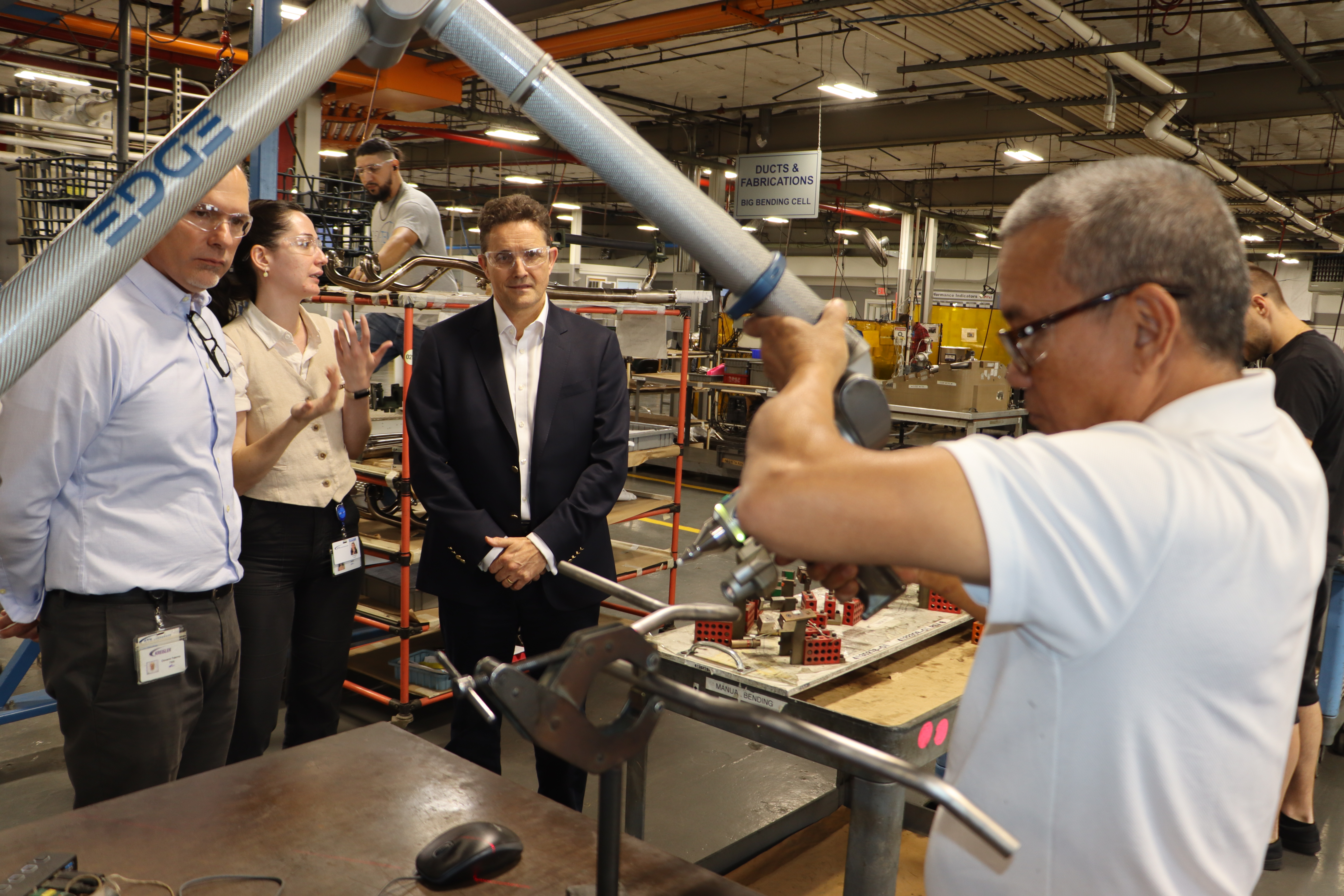 People Working In Factory During Site Visit