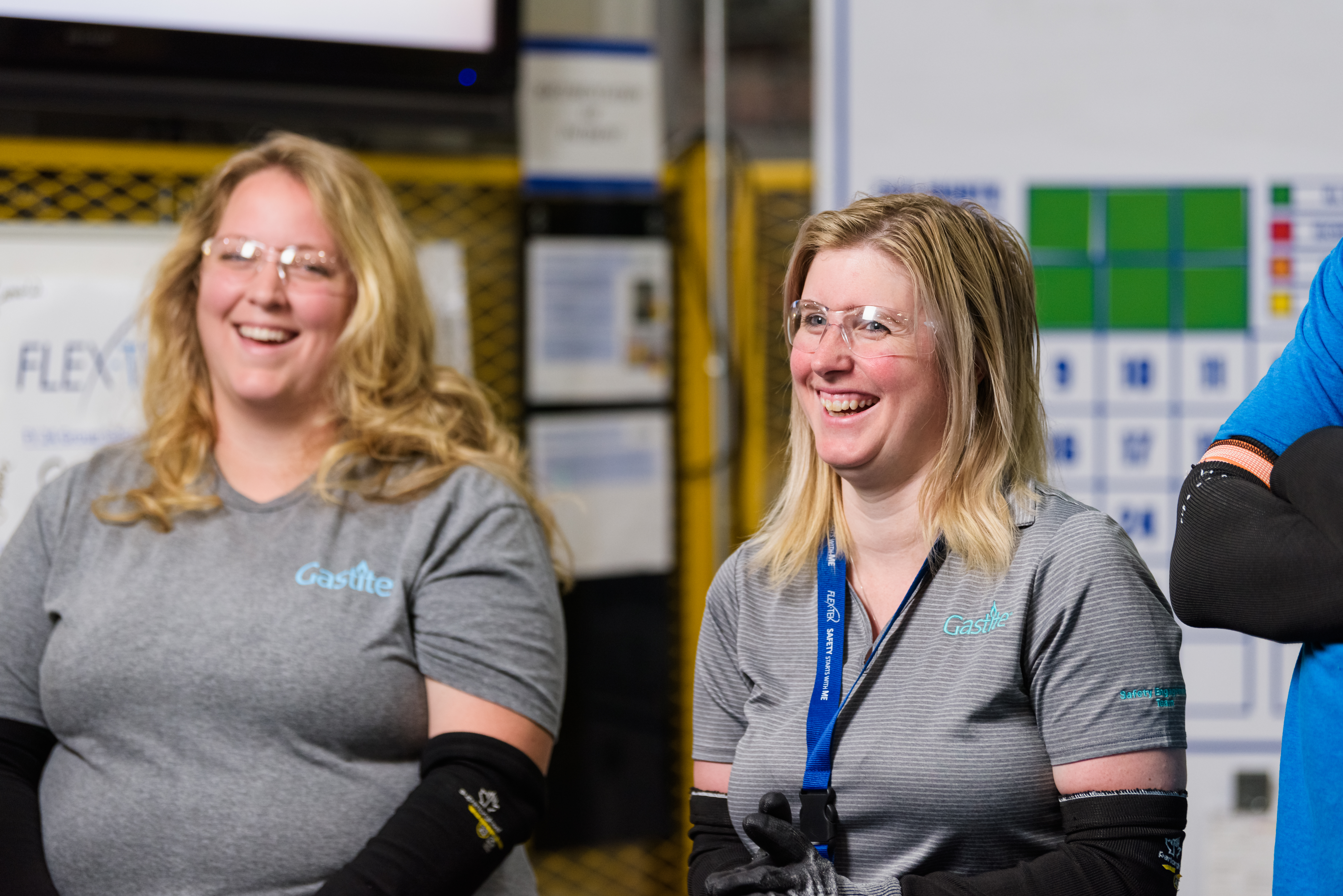 Two Females Smiling With Goggles