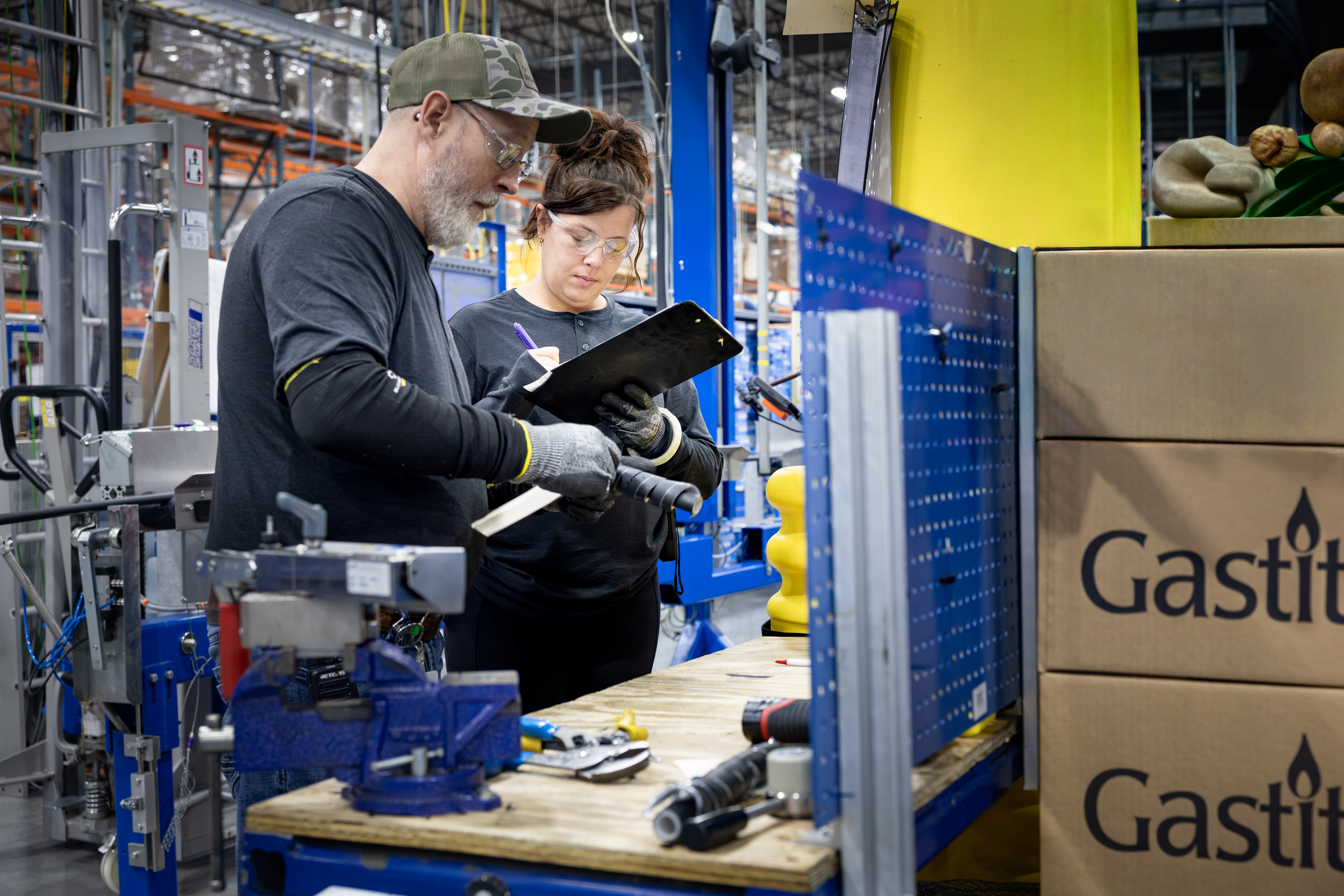 Gastite Workers Recording Details Using Clipboard