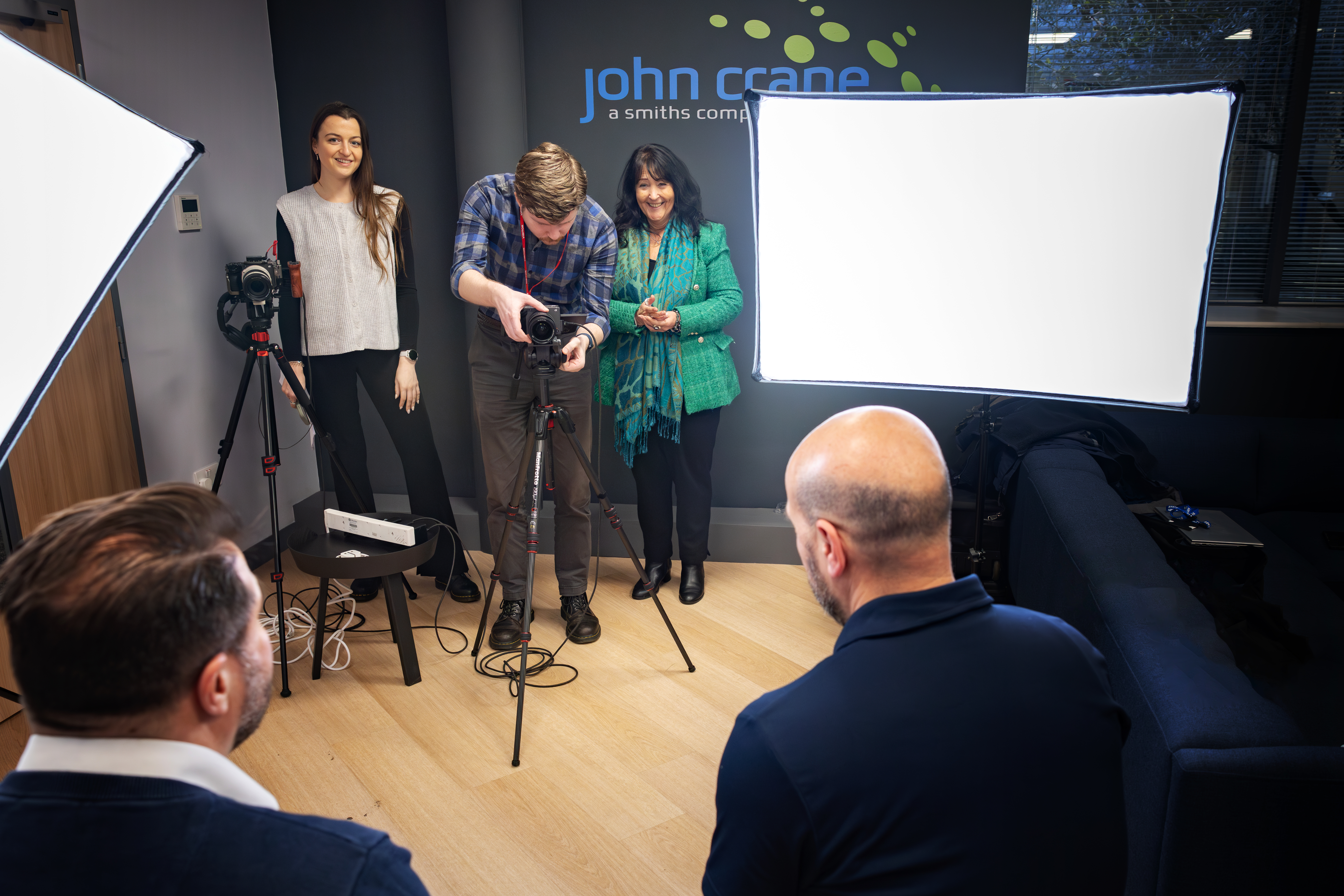 Photographs Being Taken Of Colleagues At John Crane Site