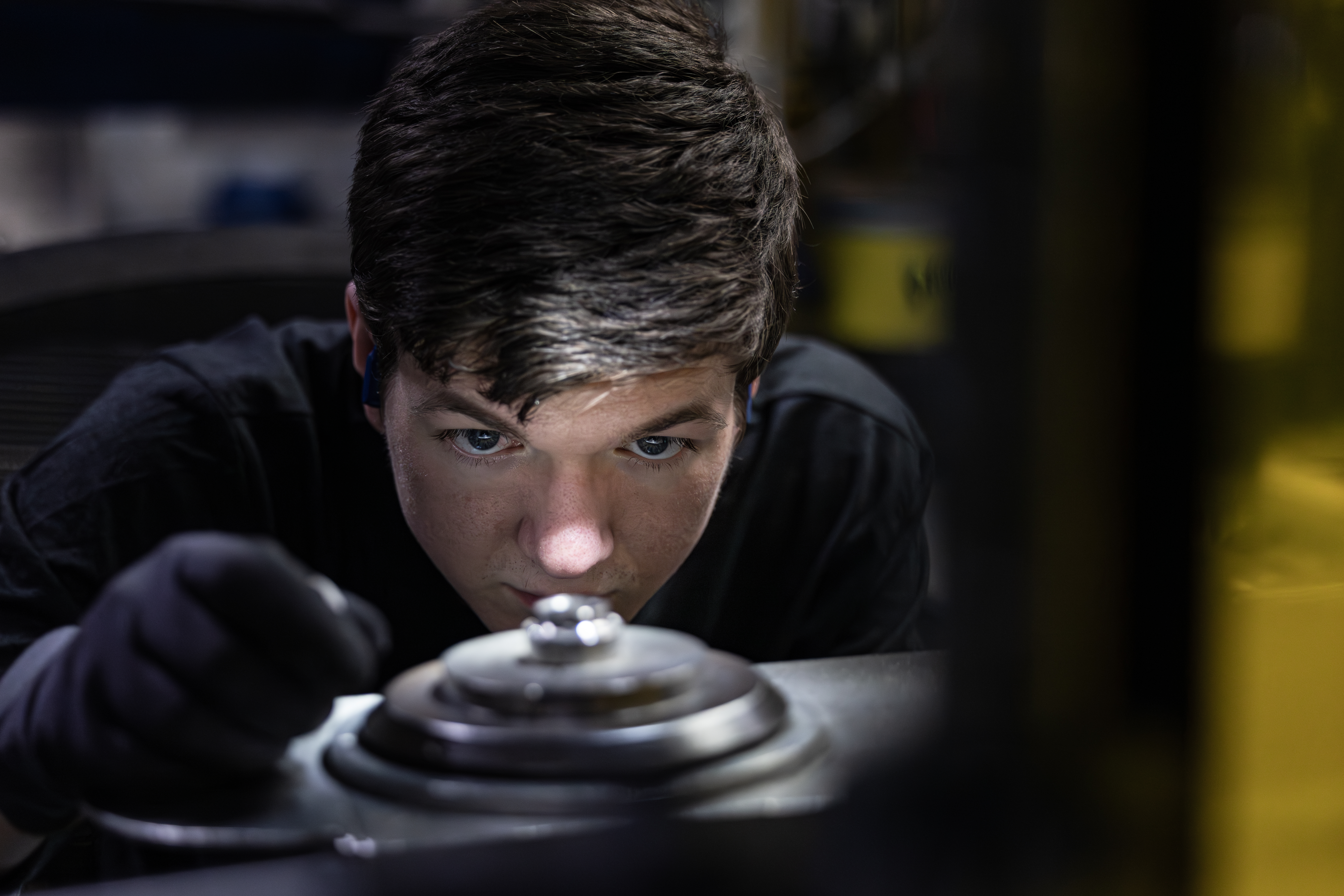 Engineer Inspecting Product Part