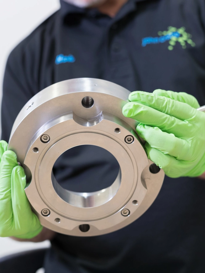 John Crane Employee Inspecting Product